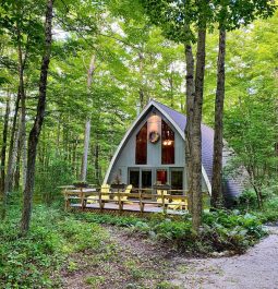 Cute cabin exterior with yellow chairs