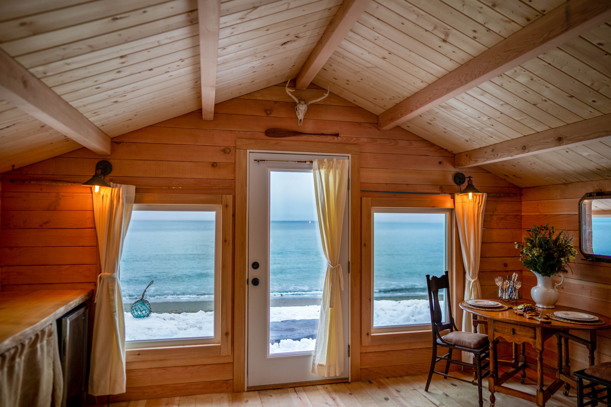 Cabin doors opening directly up to the water