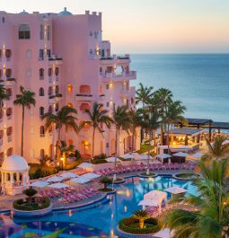 pink hotel exterior overlooking beach