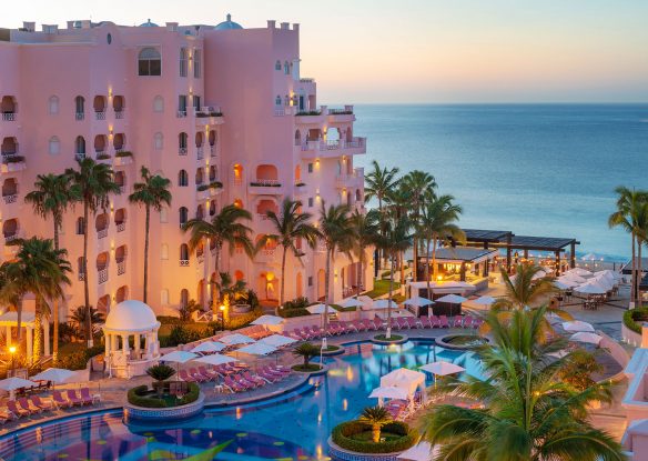 pink hotel exterior overlooking beach