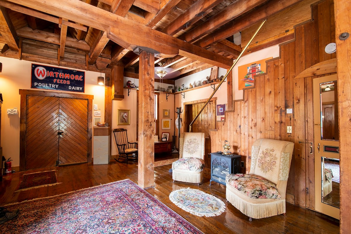 Original Grist Mill doors and grain bin entrance with 1920's fireside chairs