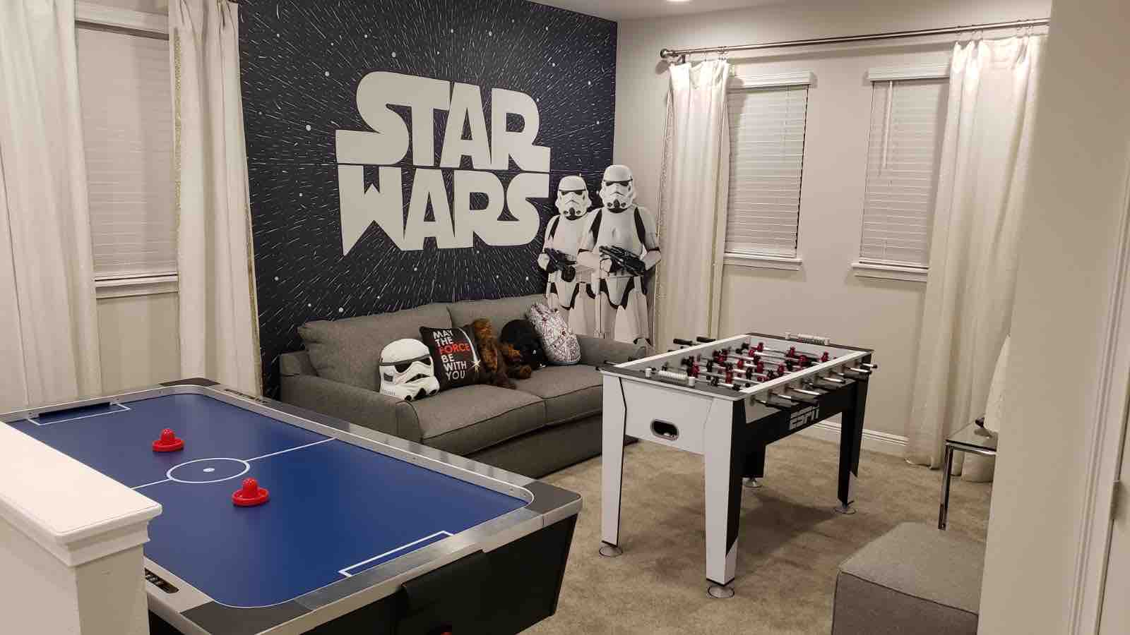 Star Wars themed games room with foosball and air hockey