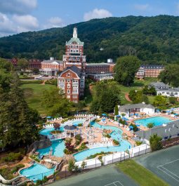 aerial view of mountain resort with swimming pool