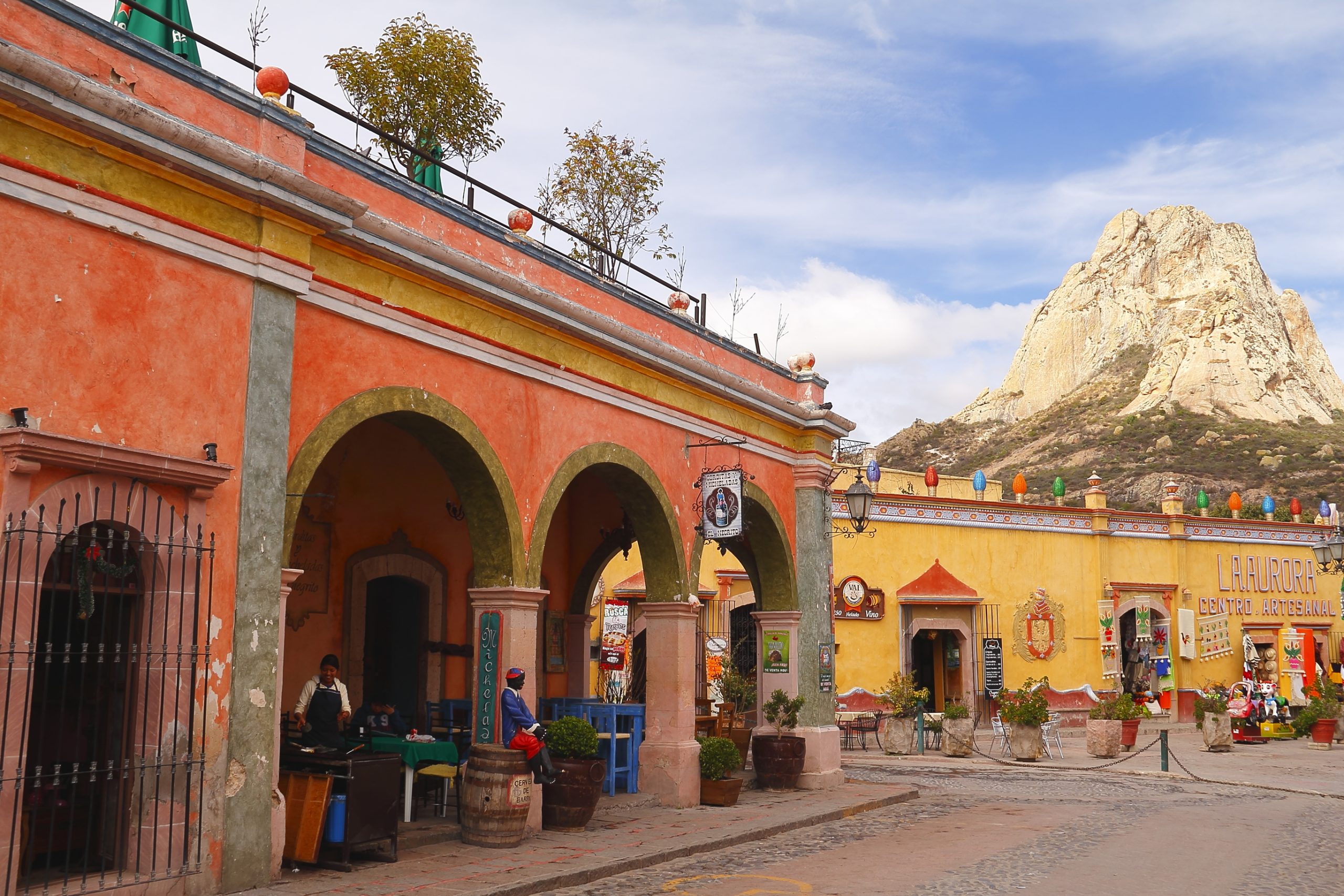 Houses and monolith in Peña de Bernal, Queretaro, Mexico