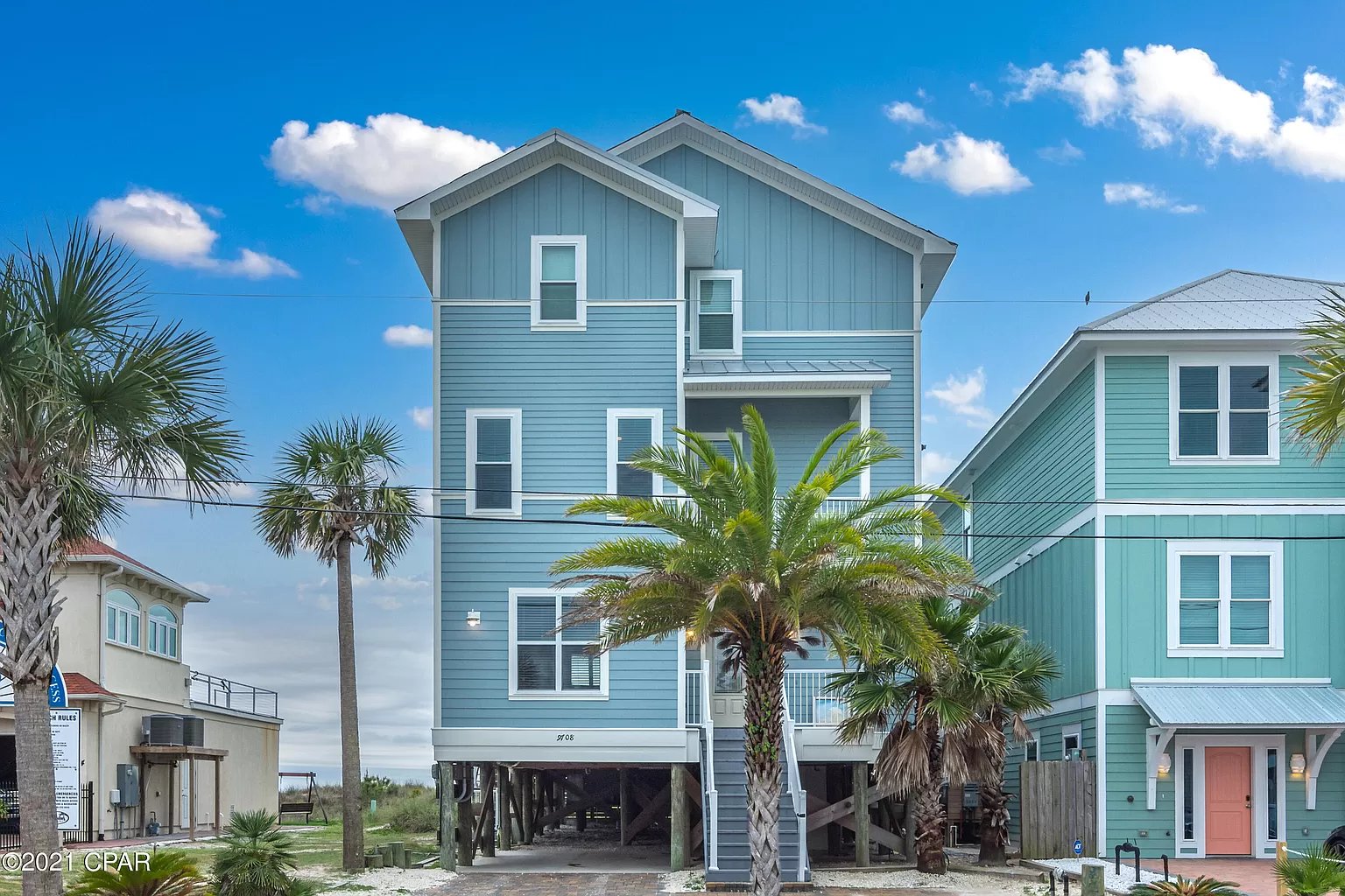 Huge blue beach house in the sunshine