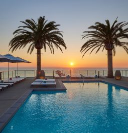 pool with a sunset and ocean view