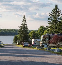 Campers with trees and water view