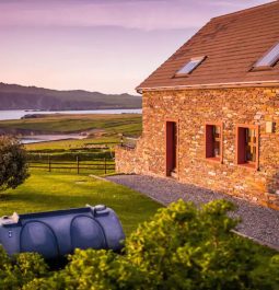 stone cottage overlooking the sea and islands