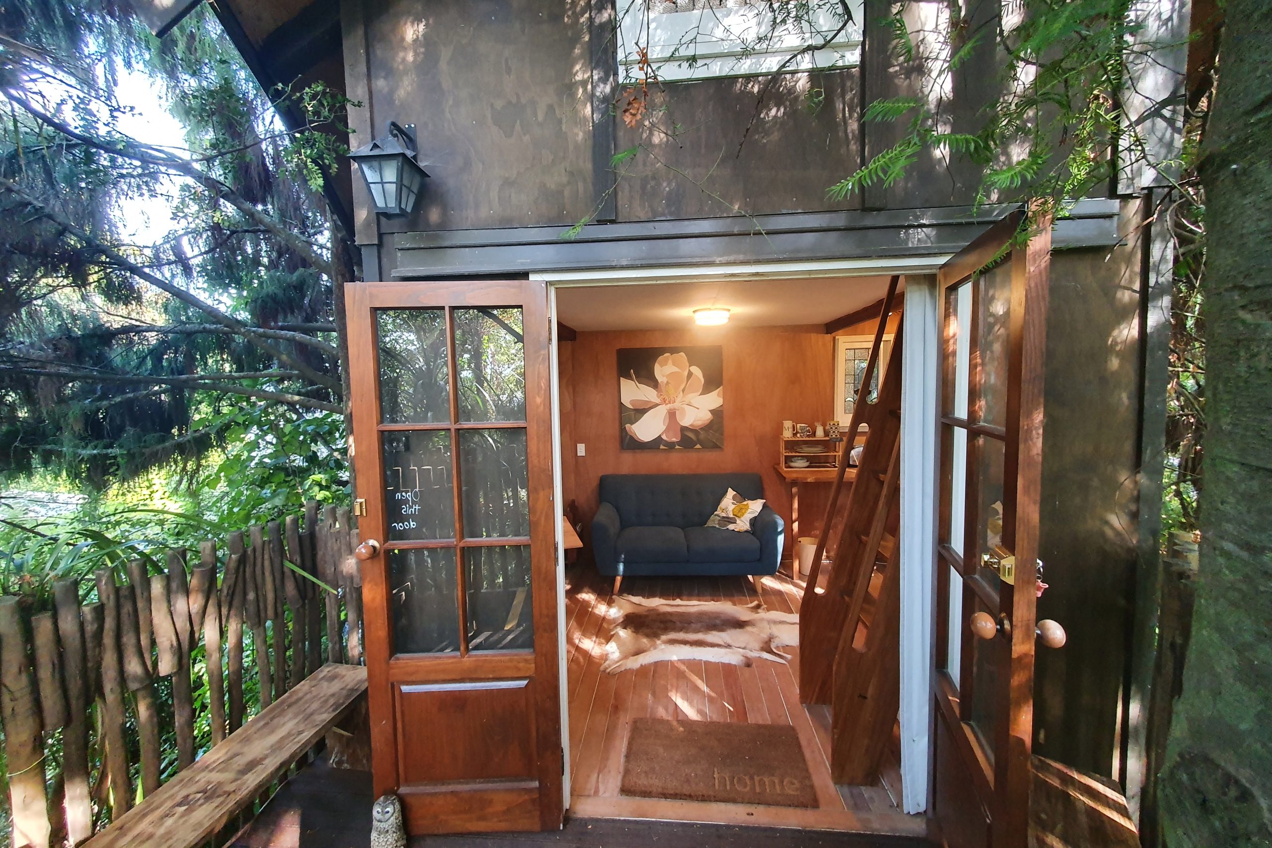 Treehouse with bright lights shining through