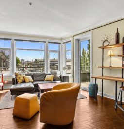 Spacious living room with floor to ceiling windows