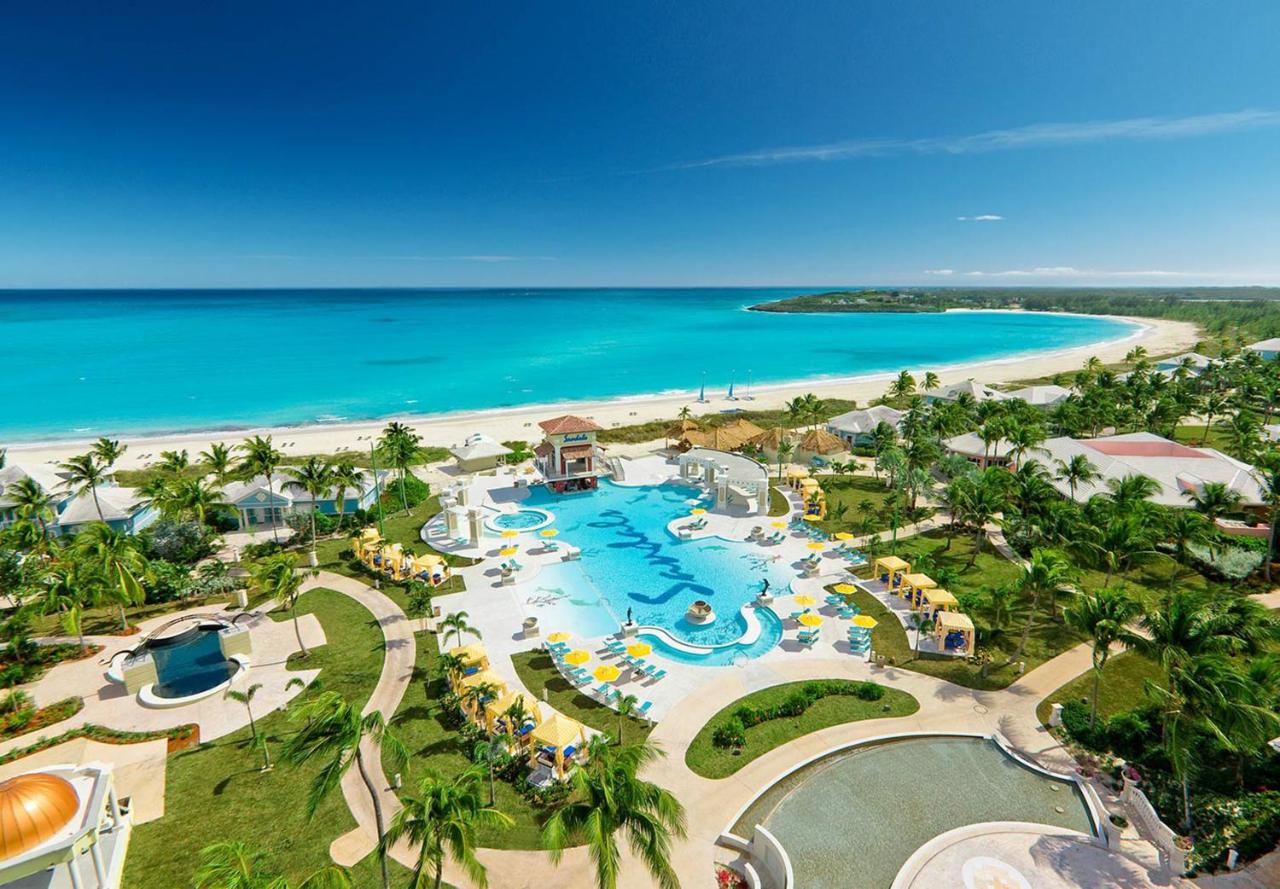 Overview of Sandals resort with azure blue water and sprawling resort