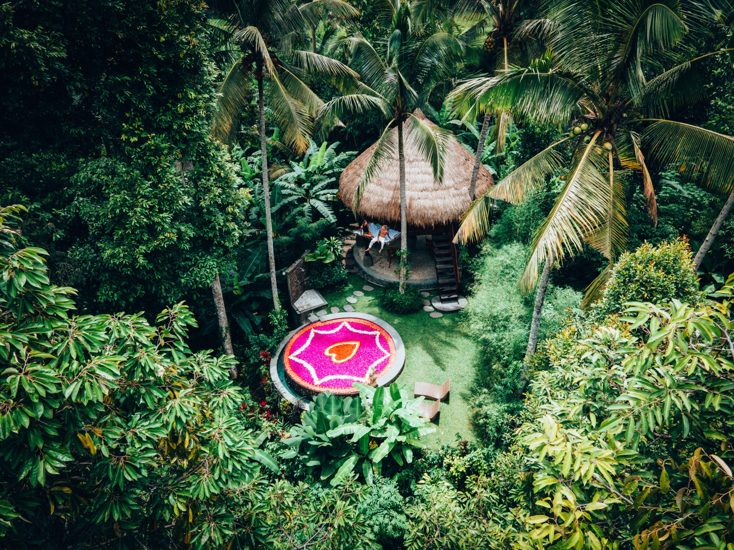 Treehouse and flower bath shrouded by forest