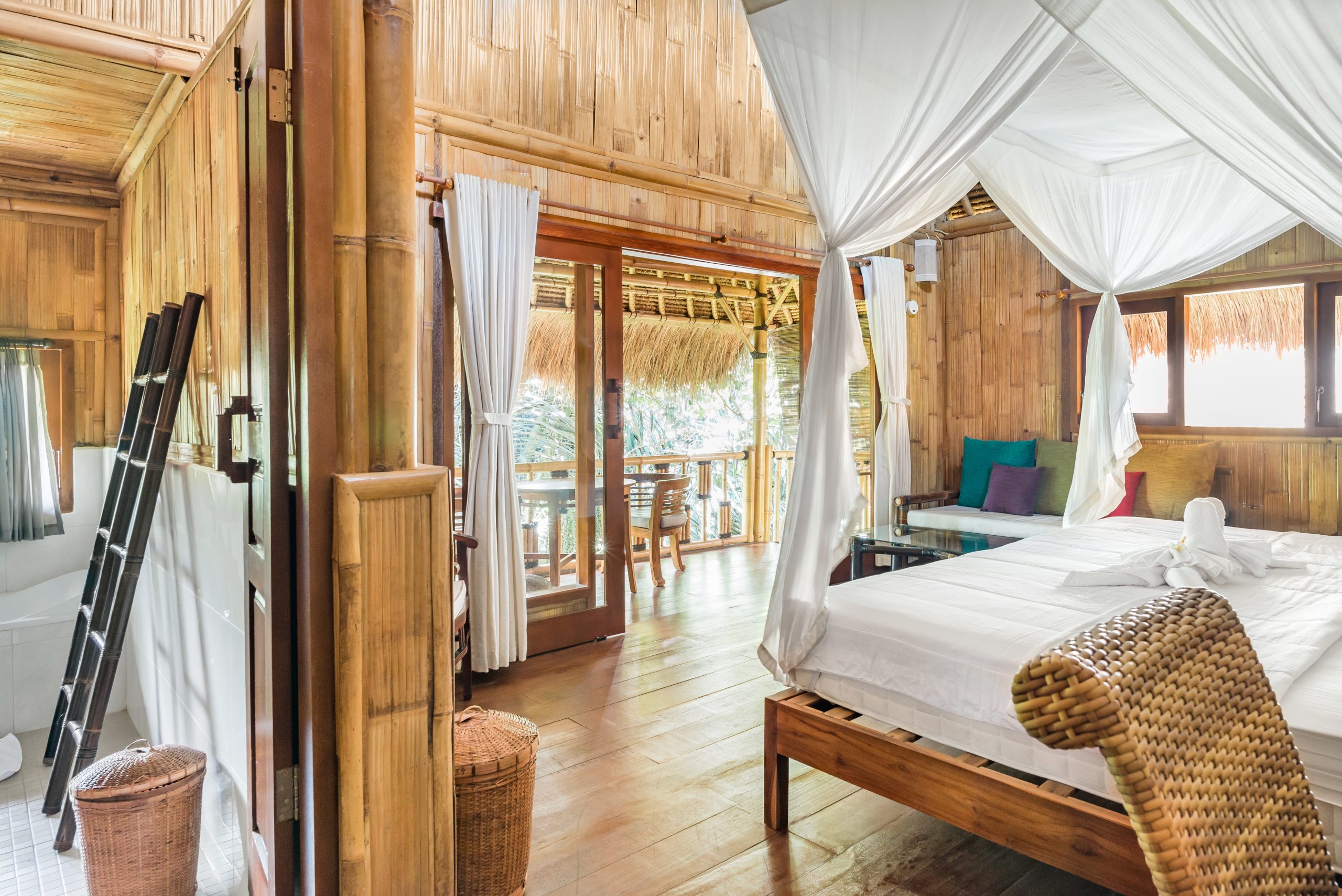 Wooden bedroom and bathroom with four poster bed and beautiful views