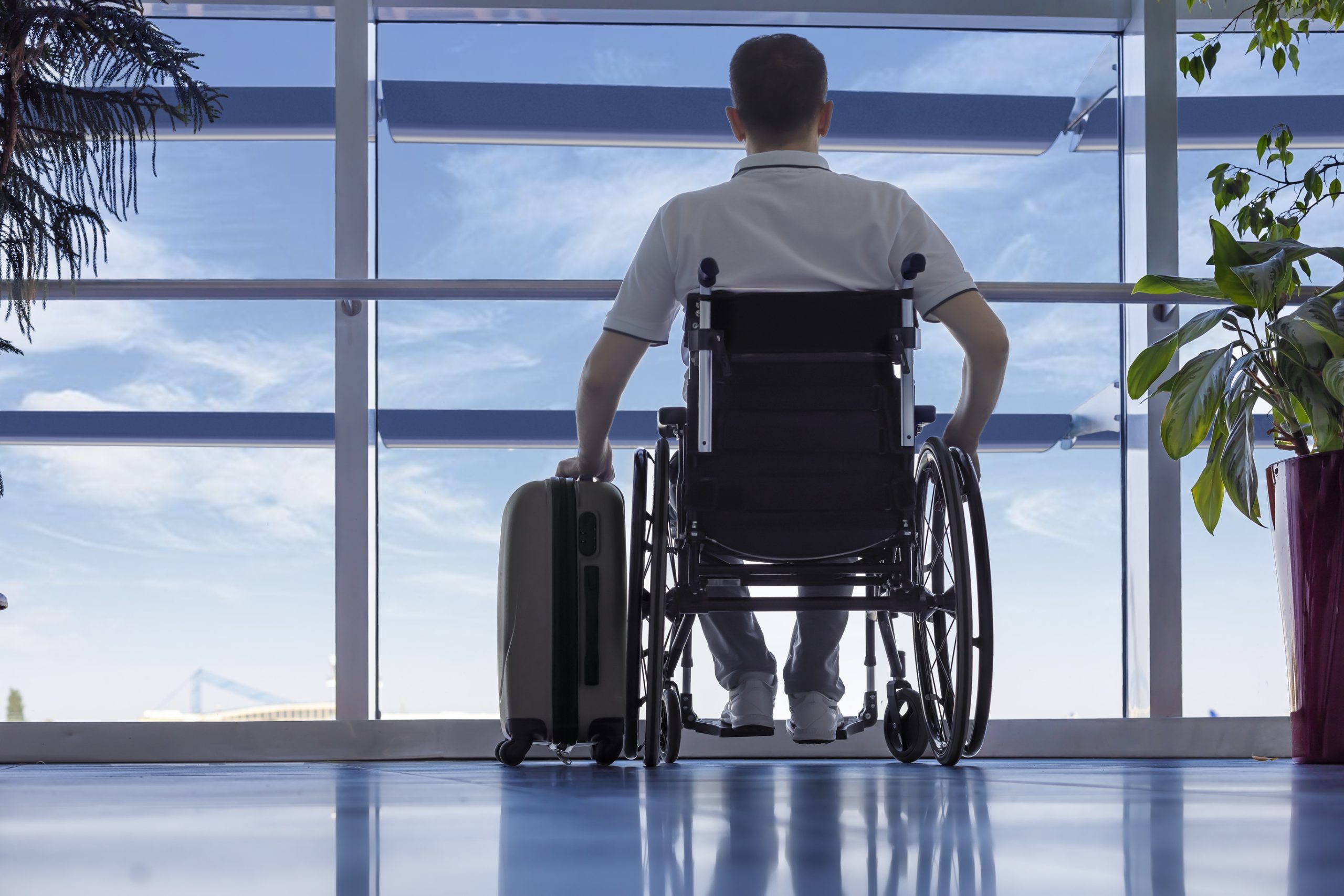 Man in a wheelchair at the airport