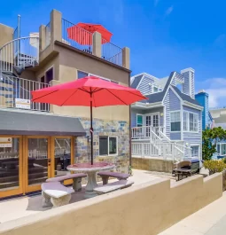 Red umbrellas outside rental home