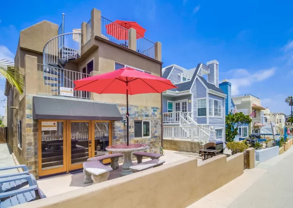 Red umbrellas outside rental home