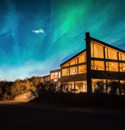 glassfront hotel under the northern lights