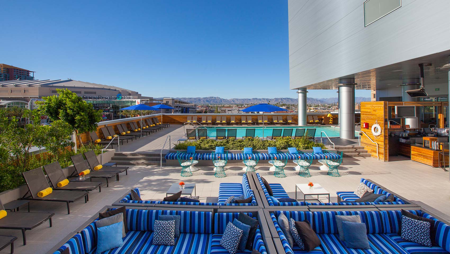 Poolside seating under the sunny skies