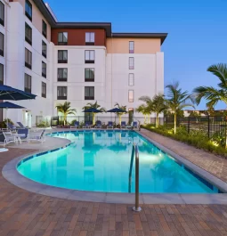 Exterior of a hotel with an outdoor swimming pool