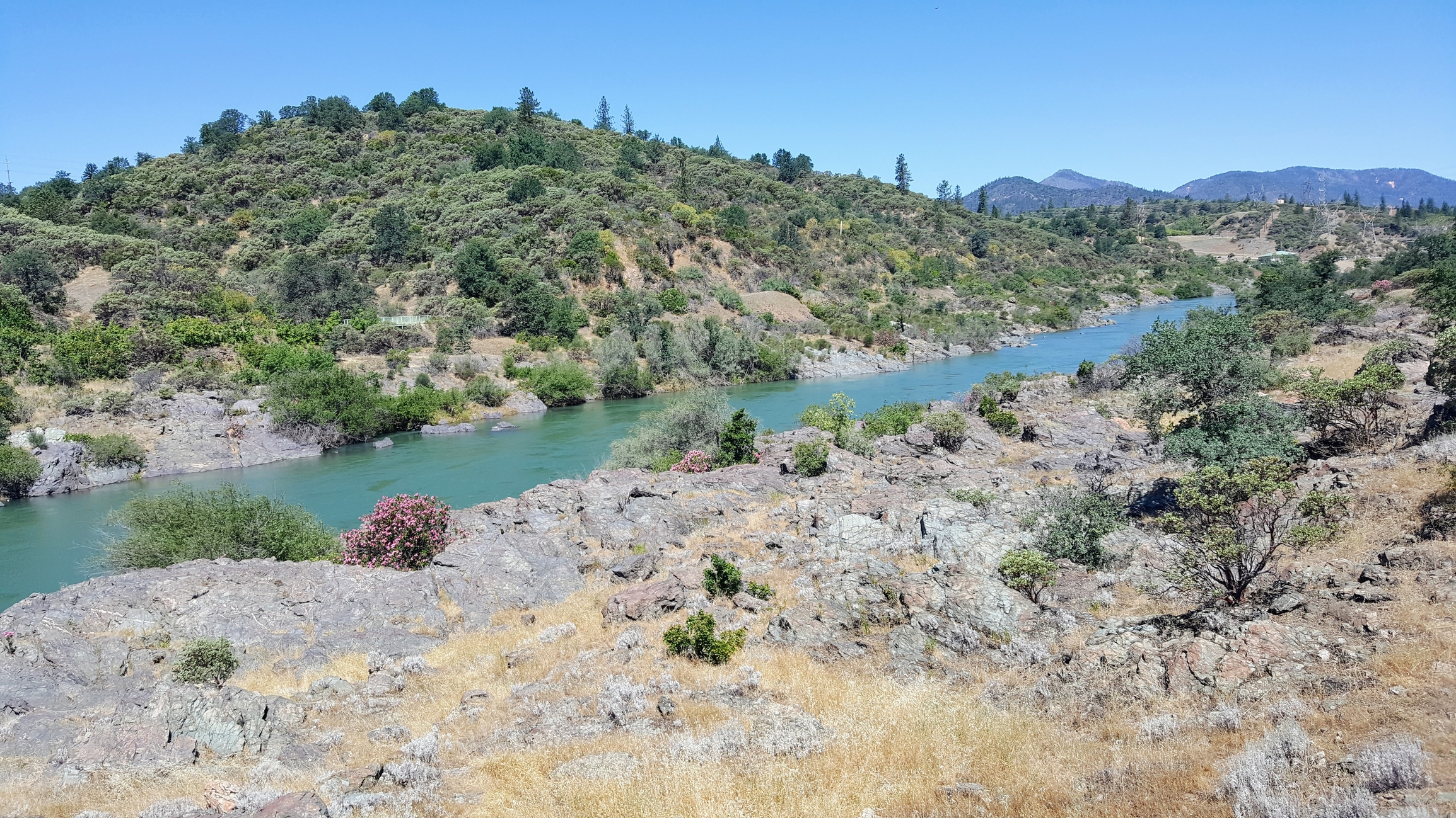 View of the beautiful Sacramento River from the adjacent walk and bike trail in Redding