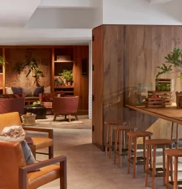 lobby area with leather seating and wood accents