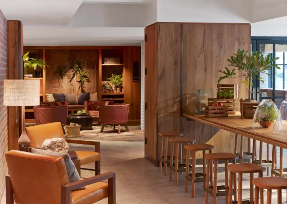 lobby area with leather seating and wood accents