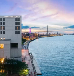 hotel by the river with a bridge