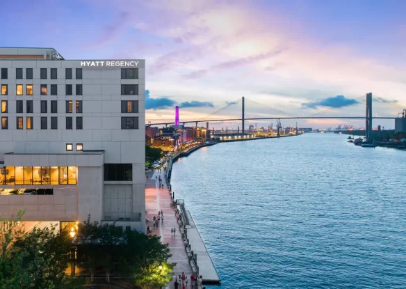 hotel by the river with a bridge