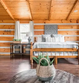 Cabin bedroom with exposed ceiling beams