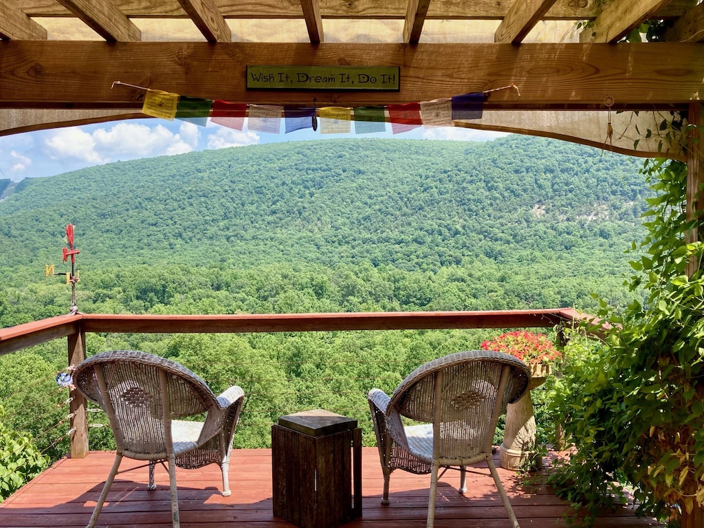 This charming mountaintop cabin has a hot tub and pool table.