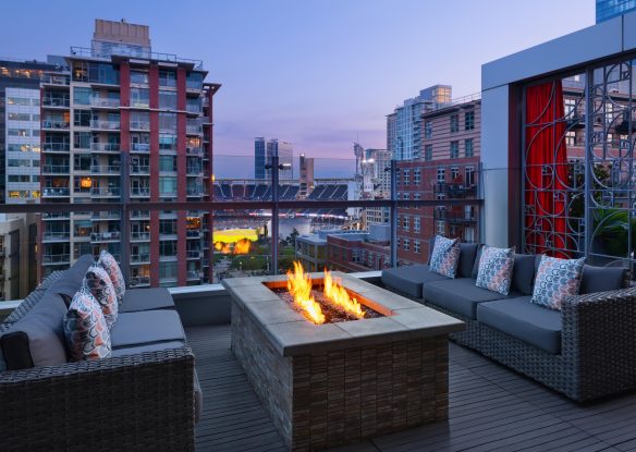 Hotel terrace with a fire pit overlooking the stadium