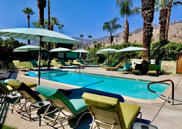 Lounge chairs next to a pool