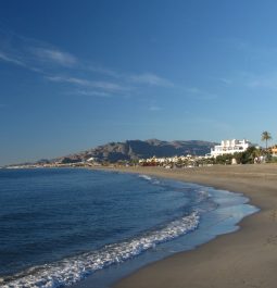 View of a sandy beach with mountains in the distance