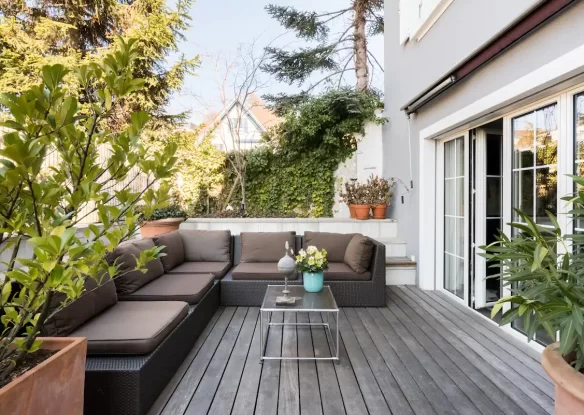 Outdoor garden terrace with a sofa