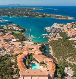 Aerial view of a bayside resort with a swimming pool