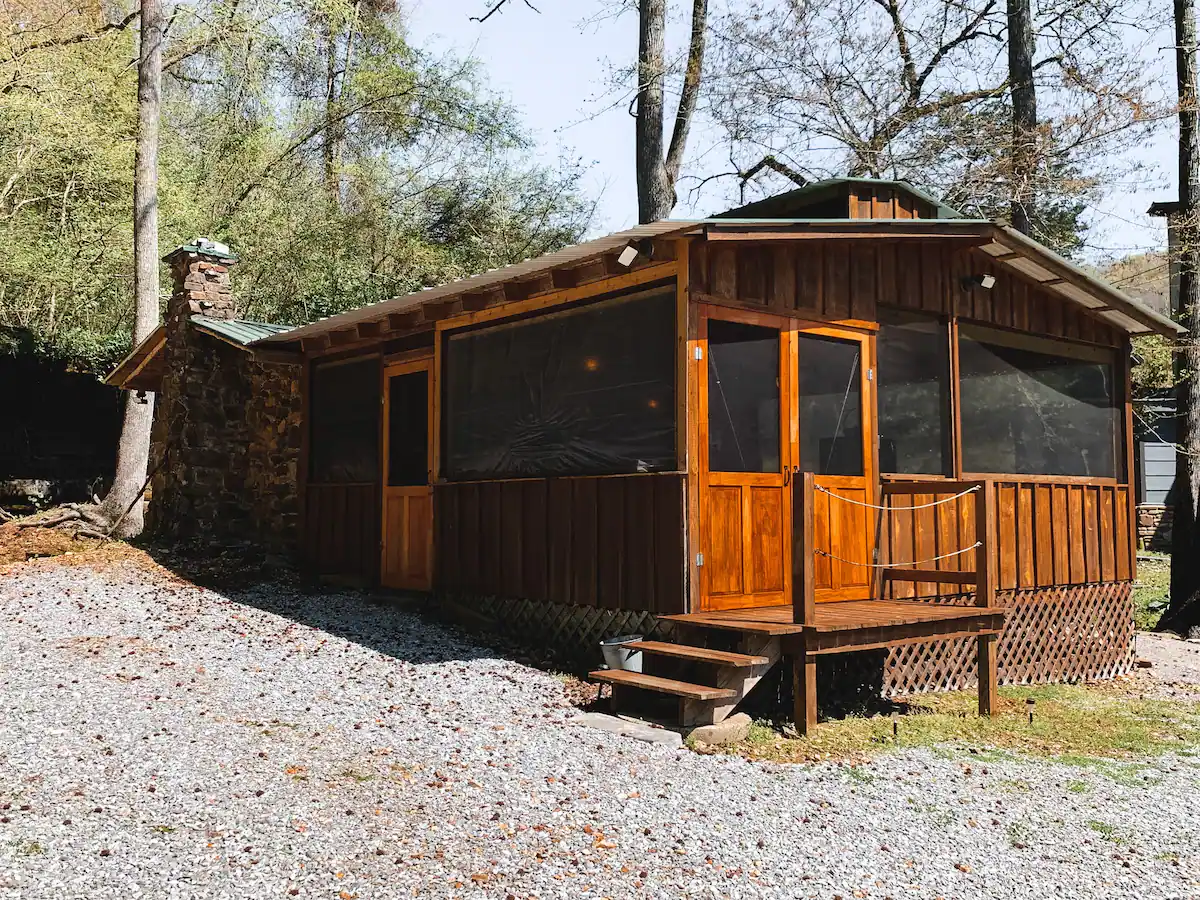 A rustic cabin built from local rock and cedar logs