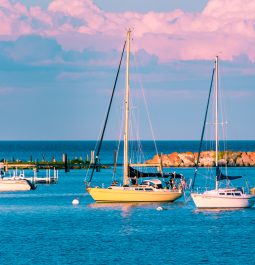 Sail boats docked at the marina at Mackinac Island during sunset