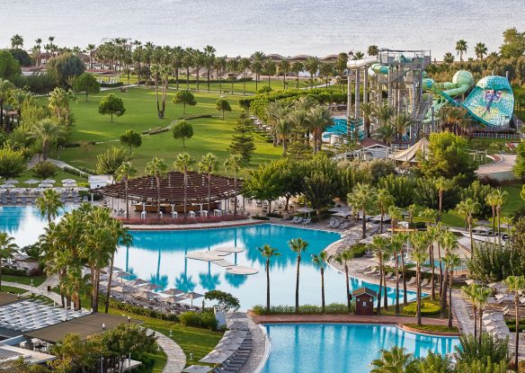 Aerial view of a resort with swimming pools and a water park