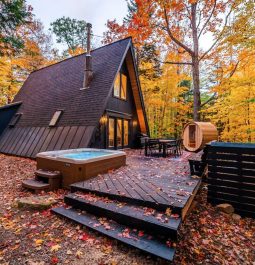 beautiful A-frame cabin and hot tub surrounded by brilliant fall foliage