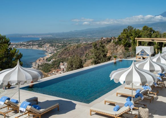 hotel swimming pool overlooking the coast and the mountains