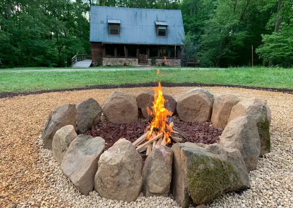 Fire pit by rental cabin