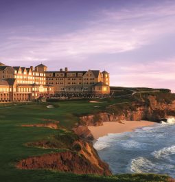 Exterior view of a hotel next to the rocky coast