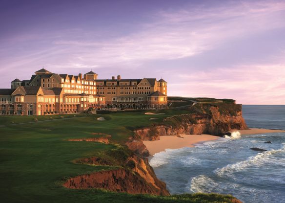 Exterior view of a hotel next to the rocky coast