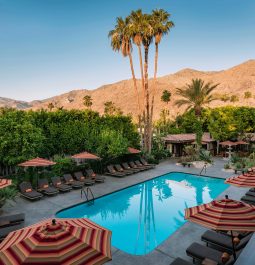 View of a resort swimming pool and the mountains in the background